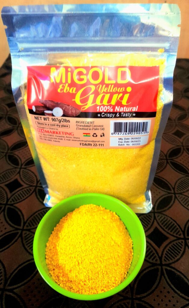 MiGold Yellow Gari in a transparent packet with sample in a small bowl in front
