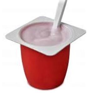 A spoon in a tin full of yoghurt