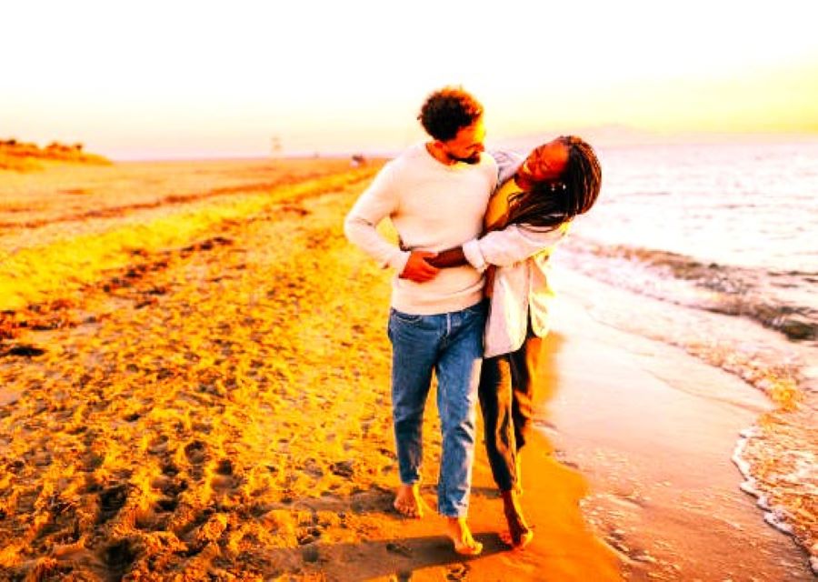 A couple strolling at the beach