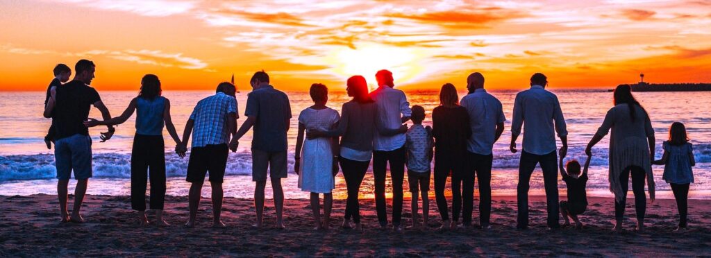 A group of families at the beachfront