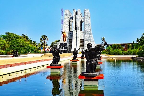 Ghanaian native male statues placed inside a pool in front of Kwame Nkrumah mausoleum