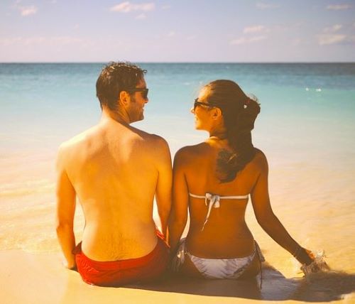 A couple sitting on the beach