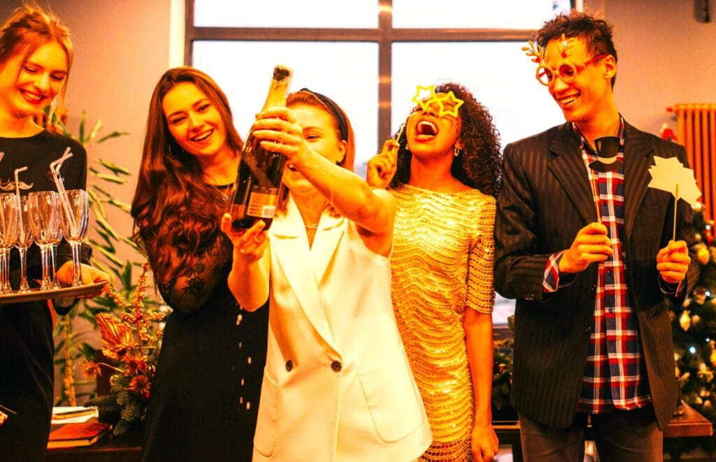 A group of people popping champagne