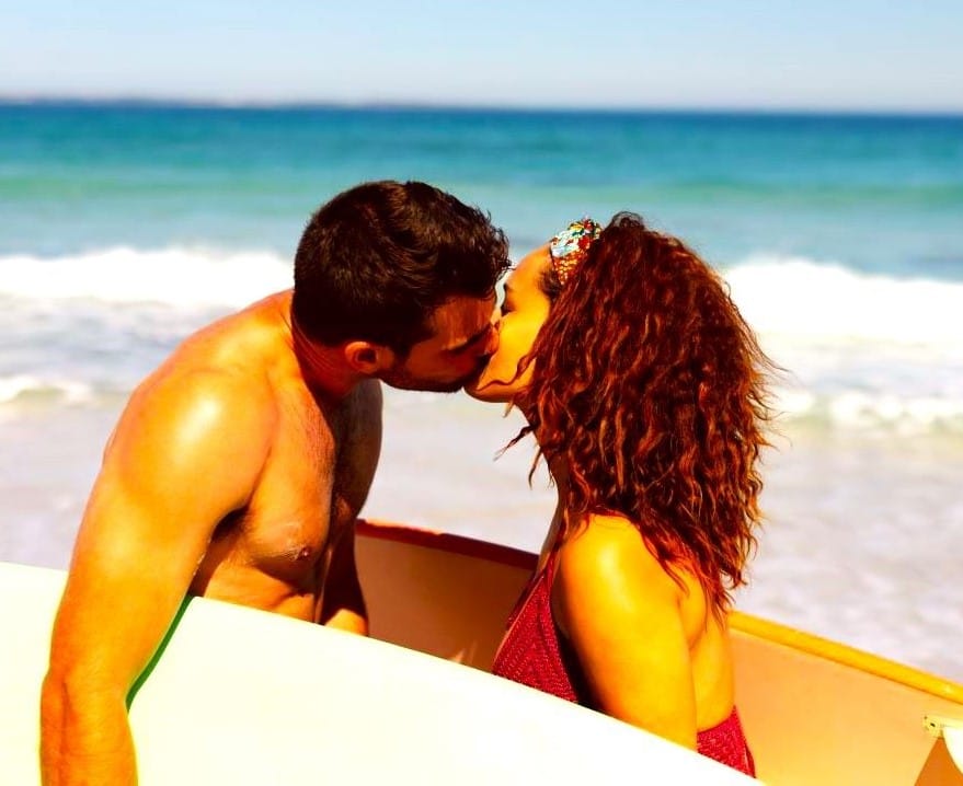 A couple kissing at the beach